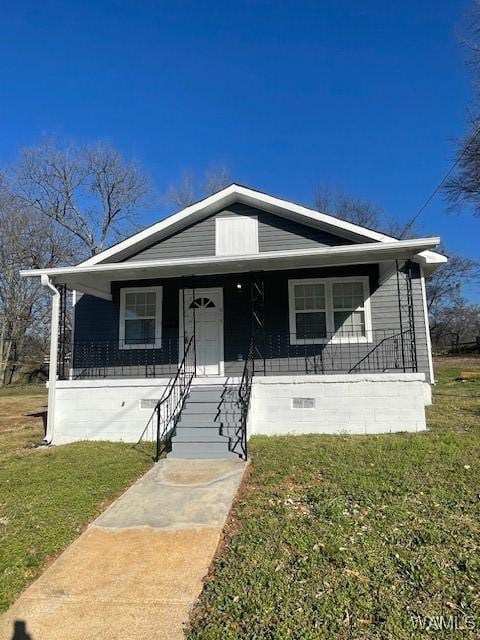 bungalow with crawl space, a front lawn, and a porch