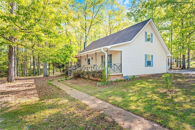 12863 N Country Dr, Tuscaloosa, AL 35475 - view of side of home with a yard, a porch, and a shingled roof