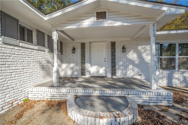 doorway to property with covered porch