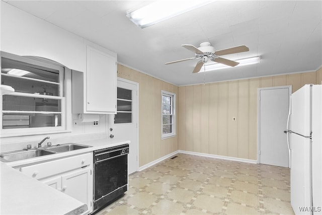 kitchen with ceiling fan, sink, white refrigerator, white cabinets, and black dishwasher