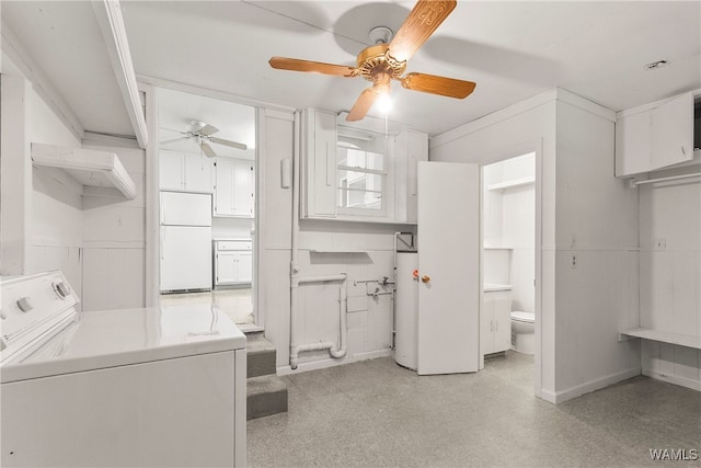 laundry area with gas water heater and washer / clothes dryer