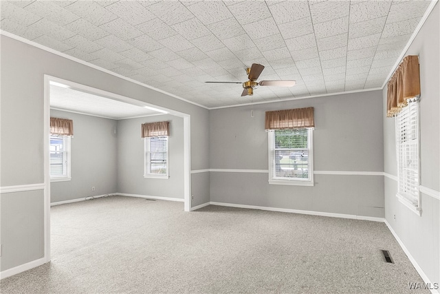 unfurnished room with ceiling fan, carpet, and a healthy amount of sunlight