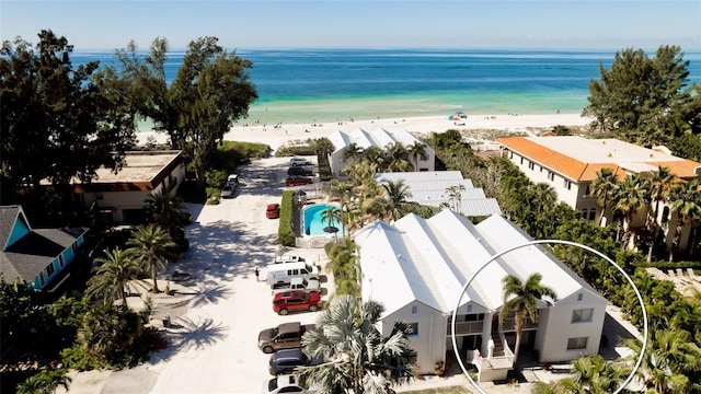 bird's eye view with a water view and a view of the beach