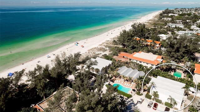 bird's eye view with a water view and a view of the beach