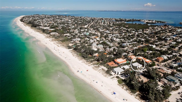 drone / aerial view featuring a water view and a view of the beach