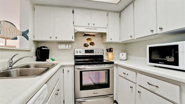 kitchen featuring white cabinets, white appliances, wall chimney exhaust hood, and sink