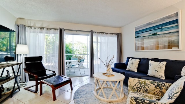 tiled living room with a textured ceiling