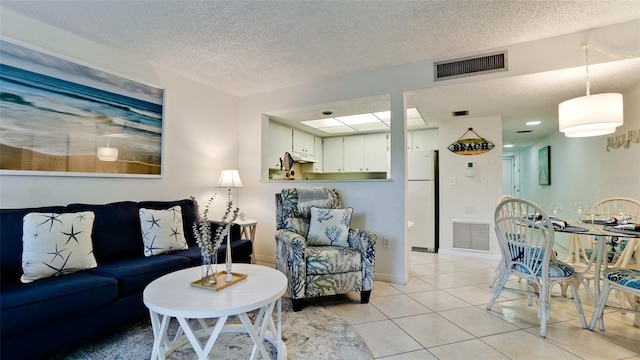 tiled living room with a textured ceiling