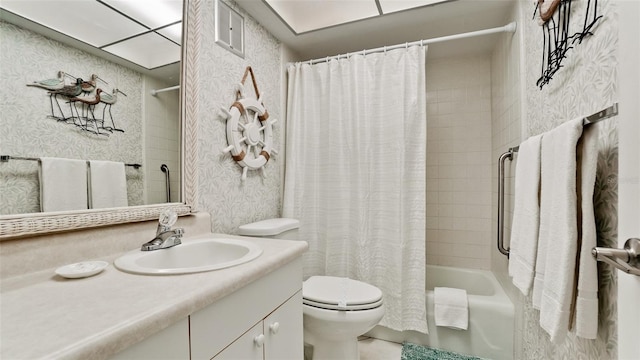 full bathroom featuring shower / bath combination with curtain, toilet, and vanity