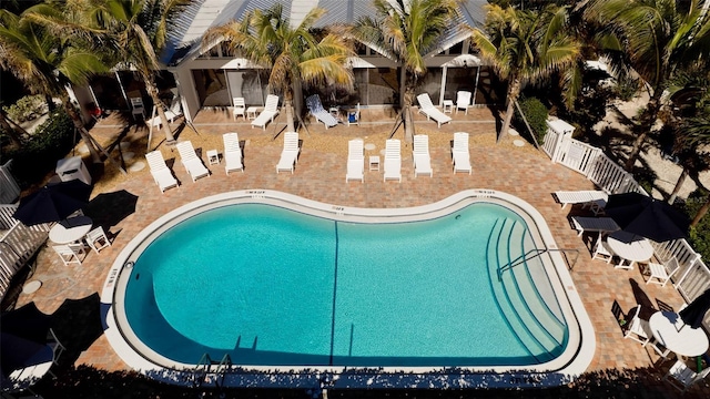 view of swimming pool featuring a patio area