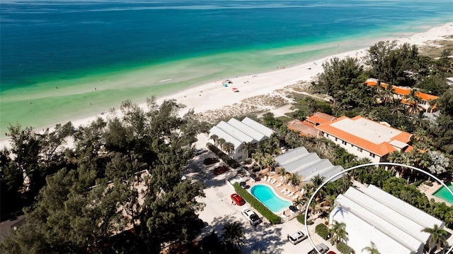 drone / aerial view featuring a view of the beach and a water view