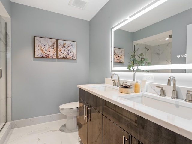 bathroom featuring vanity, toilet, and a shower with shower door