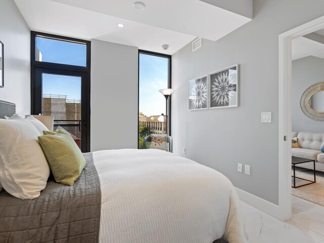 bedroom with multiple windows