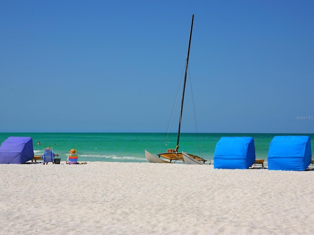 property view of water featuring a beach view