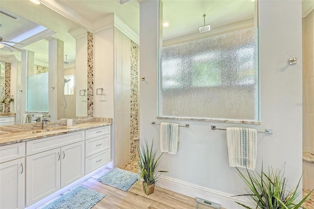 bathroom featuring vanity, hardwood / wood-style floors, and ceiling fan