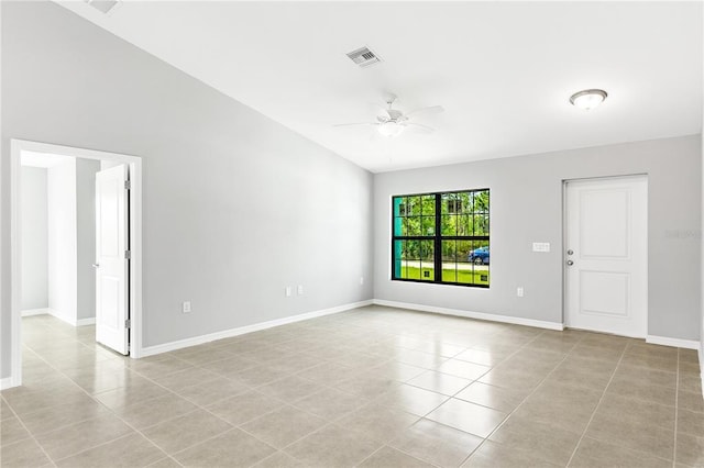 tiled spare room featuring ceiling fan