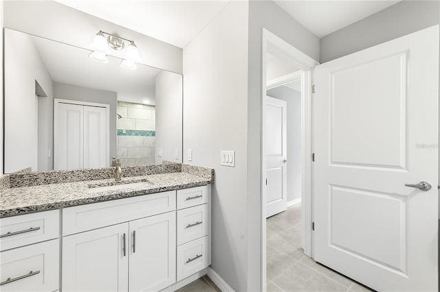 bathroom featuring tile floors and vanity