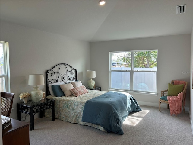 carpeted bedroom featuring vaulted ceiling