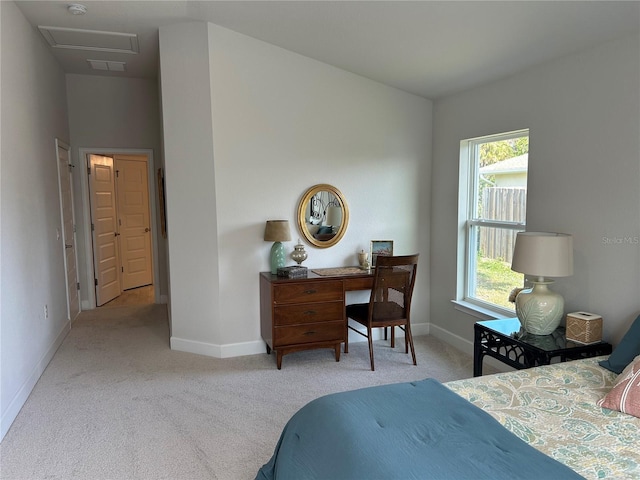 bedroom with light colored carpet