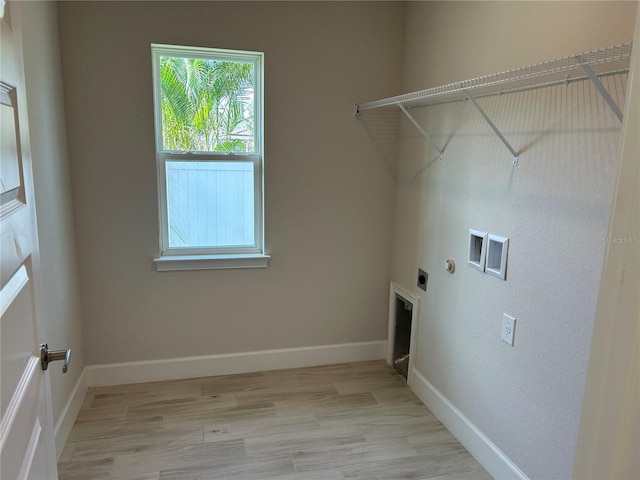 washroom featuring hookup for a washing machine, light hardwood / wood-style flooring, and hookup for an electric dryer