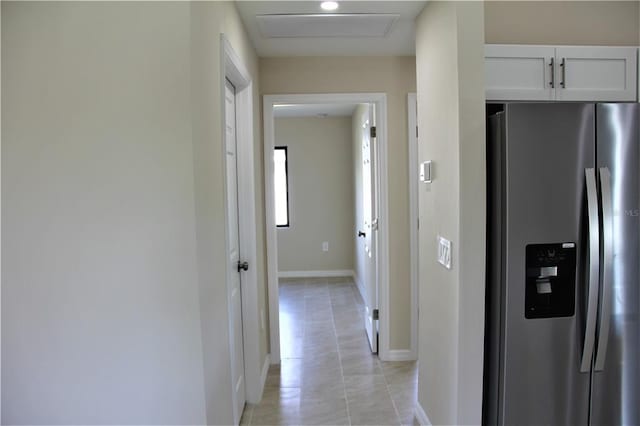 corridor with light tile floors