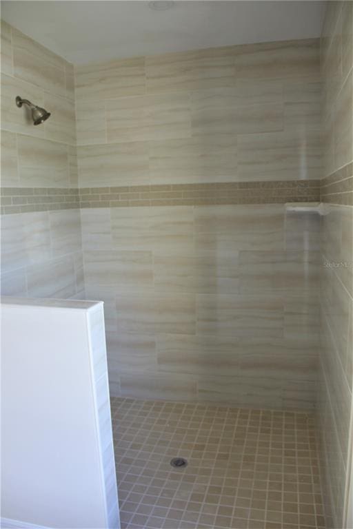 bathroom with tiled shower