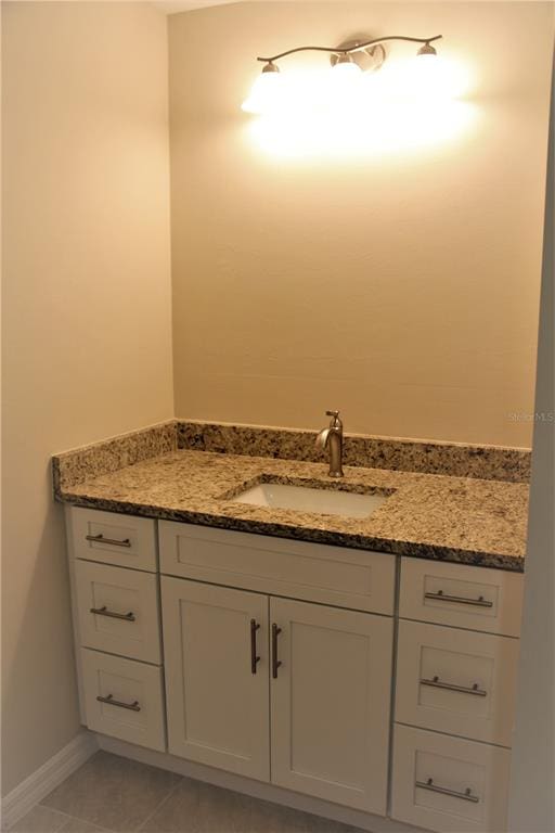 bathroom featuring vanity and tile flooring