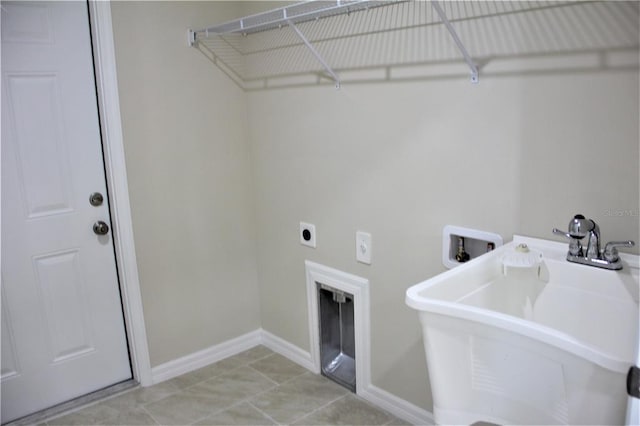 washroom featuring light tile flooring, electric dryer hookup, and hookup for a washing machine