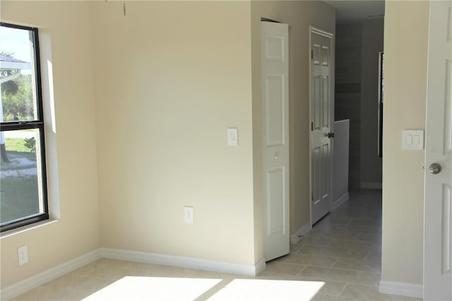 interior space featuring light tile floors