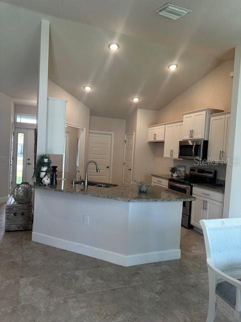 kitchen featuring visible vents, appliances with stainless steel finishes, a sink, and white cabinetry