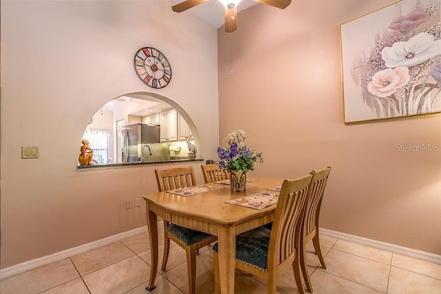 dining room with light tile patterned flooring and ceiling fan