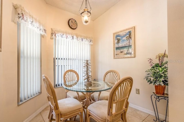 dining area featuring light tile patterned floors