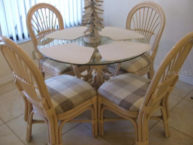 dining area with tile patterned flooring