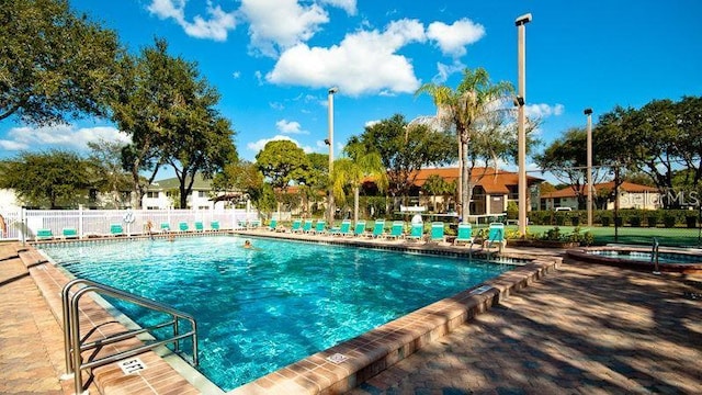 view of swimming pool with a patio area