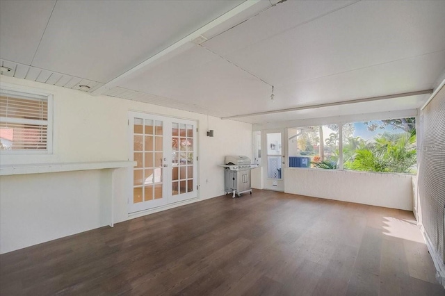 unfurnished sunroom with french doors