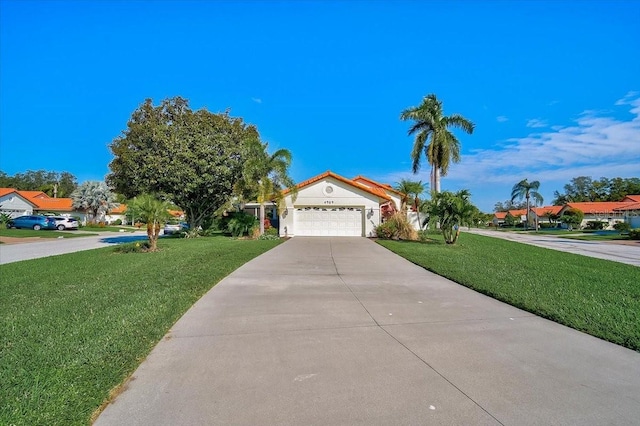 view of front facade featuring a front lawn and a garage