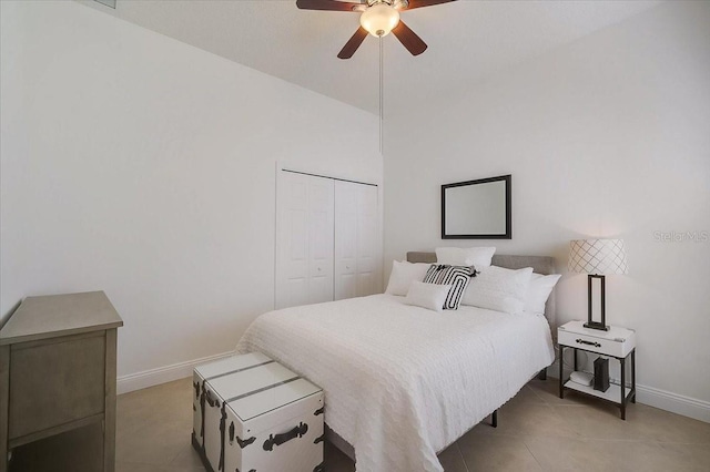 bedroom with ceiling fan and a closet