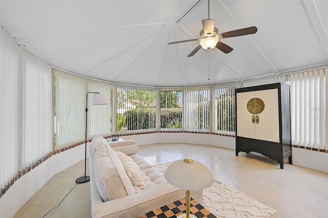 sunroom / solarium with ceiling fan and vaulted ceiling