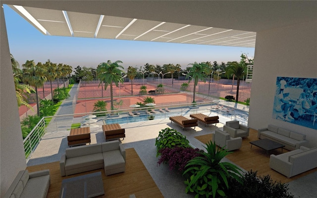 view of patio / terrace with a balcony, an outdoor hangout area, and a fenced in pool