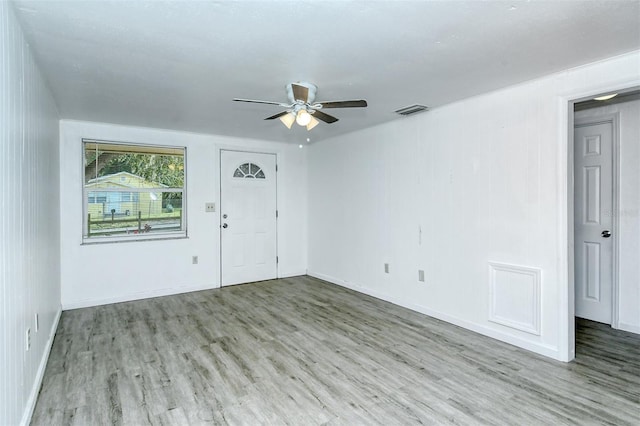 empty room featuring ceiling fan and hardwood / wood-style flooring