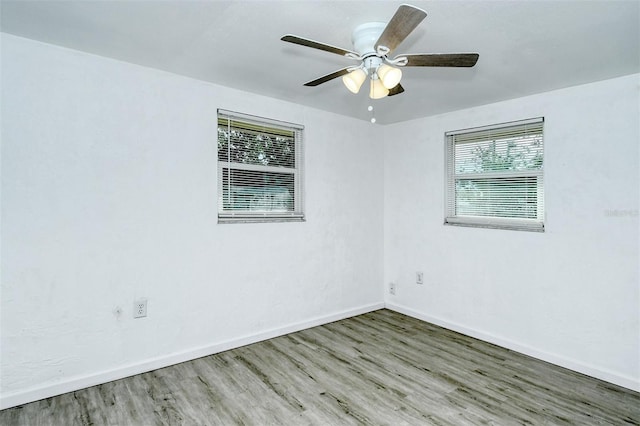 empty room featuring ceiling fan and wood-type flooring