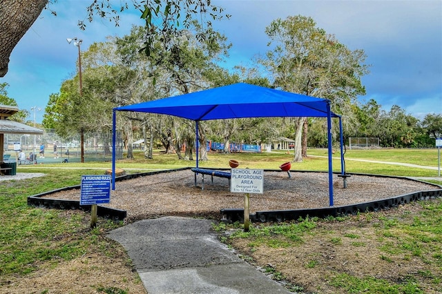 view of jungle gym with a lawn