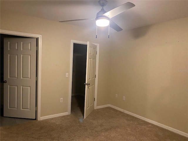 unfurnished bedroom featuring ceiling fan and light colored carpet