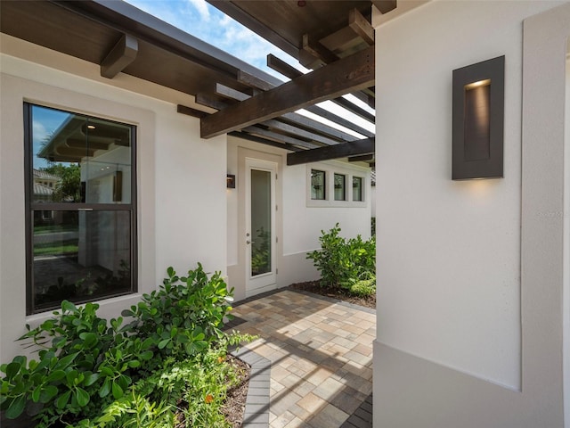 doorway to property featuring a patio