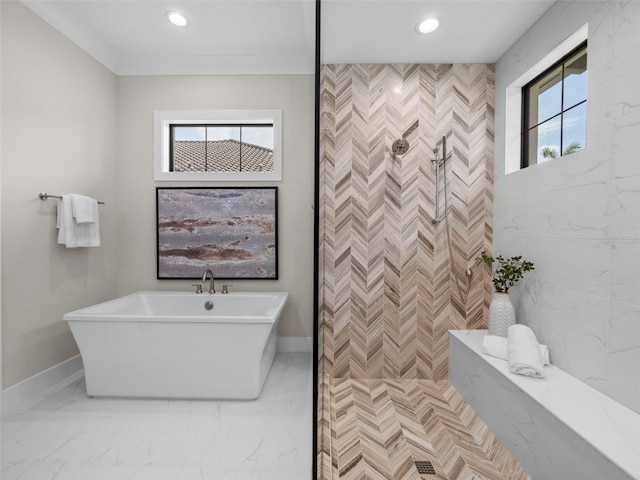 bathroom featuring ornamental molding and shower with separate bathtub