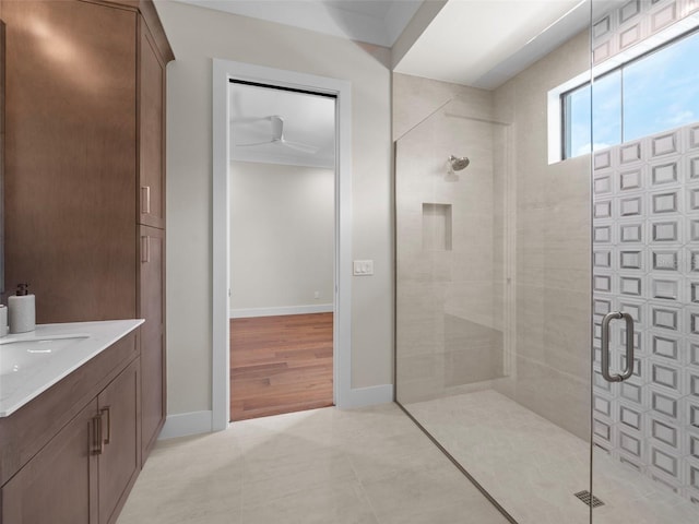 bathroom featuring vanity, tile patterned flooring, and a shower with door