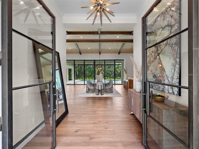 hallway featuring an inviting chandelier, light hardwood / wood-style floors, french doors, and beamed ceiling