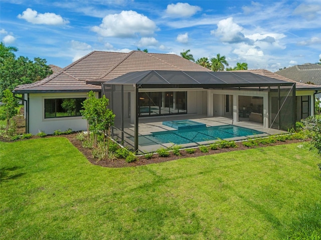 back of house with a yard, a patio area, and glass enclosure