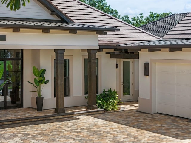 exterior space featuring a garage and a patio