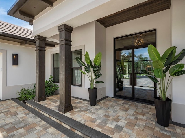 property entrance featuring french doors and a patio